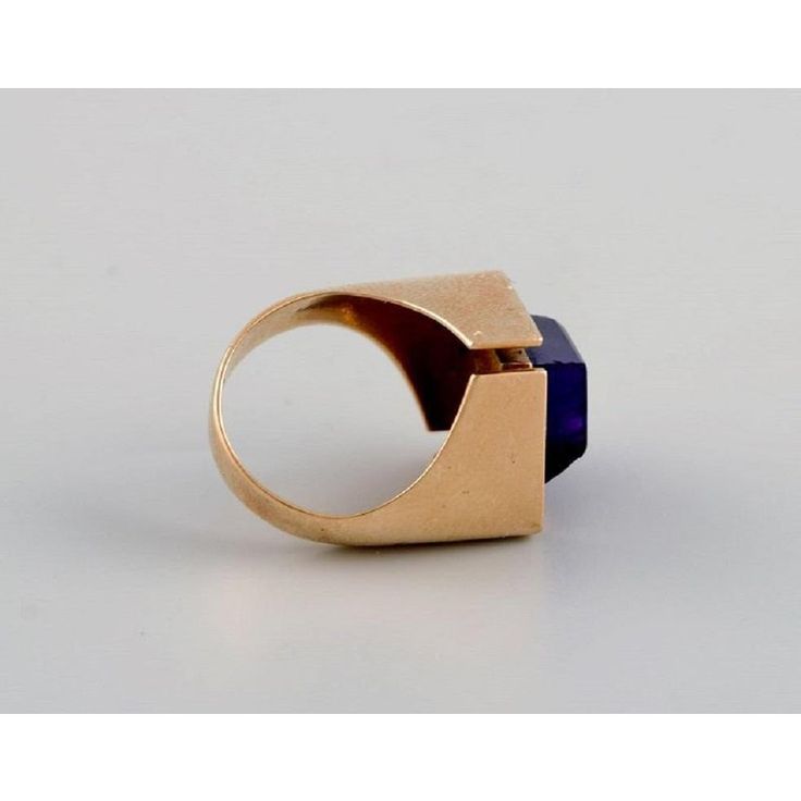 Allan Børge Larsen. Danish goldsmith (active 1967-2006). Modernist vintage ring in 14 carat gold adorned with purple amethyst. Diameter: 17 mm. US size: 6.5. In excellent condition. Stamped. Weight: 9 grams. This piece is attributed to the mentioned designer/maker. It has no attribution mark and no   official proof of authenticity,   however it is well documented in design history. I take full responsibility for any authenticity         issues arising from misattribution Modernist Open Signet Ring For Formal Occasions, Modernist Oval Jewelry For Formal Occasions, Modern Gold Amethyst Ring, Modern Yellow Gold Sapphire Ring For Formal Events, Modernist Hallmarked 14k Gold Jewelry, Modernist 14k Gold Hallmarked Rings, Modernist Hallmarked Oval Jewelry, Modern Yellow Gold Collectible Rings, Art Deco Yellow Gold Amethyst Ring For Formal Occasions