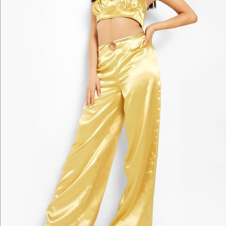 Nwt Size Us 0/ Size Uk 4 (Waist 25, Hips 34.5) (Bust 32) More Of A Brassy Gold Rather Than Yellow Shade And The Chain Can Be Adjusted On The Pants To Your Desired Look! Trendy Gold Bottoms For Parties, Trendy High Waist Gold Pants, Glamorous Gold Bottoms For Night Out, Chic Fitted Gold Bottoms, Chic Gold Fitted Bottoms, Glamorous High-waist Gold Bottoms, Glamorous High Waist Gold Bottoms, Gold Long Pants For Summer, Trendy Gold Wide Leg Pants