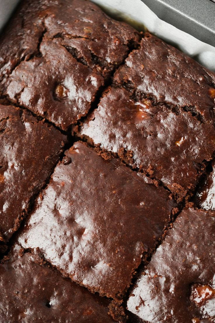 a pan filled with brownies sitting on top of a counter