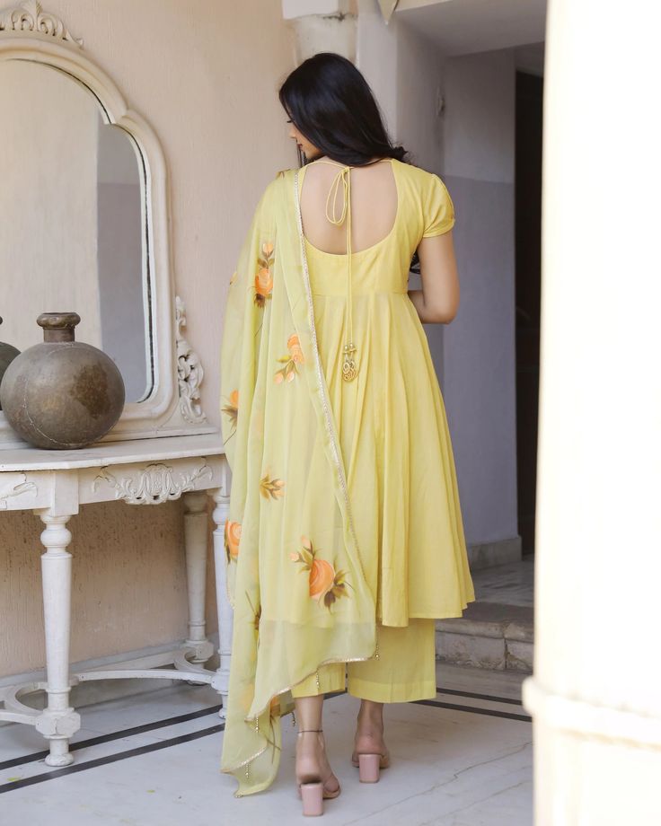 This is a beautiful 3 piece anarkali suit set.The set includes anarkali style kurta has round neck, short sleeves & calf length.It also comes with solid pants with semi elasticated waistband and a hand painted dupatta with and tassels and lace detailing. Suit Fabric-Mul Cotton Dupatta Fabric-Chiffon Length-Calf Length Color - Yellow Neck-Round Neck Sleeves-3/4th sleeves Washing Care-Dry Clean or Quick Deep Wash DISCLAIMER - The color of the product may be differ due to screen settings of device. Summer Festive Anarkali Set, Summer Georgette Anarkali Set With Resham Embroidery, Traditional Anarkali Set With Sheer Dupatta For Summer, Summer Semi-stitched Chanderi Anarkali Set, Summer Chanderi Semi-stitched Anarkali Set, Summer Anarkali Set With Resham Embroidery, Summer Chanderi Anarkali Set With Dupatta, Designer Anarkali Sets For Summer, Summer Anarkali Set With Dabka Work