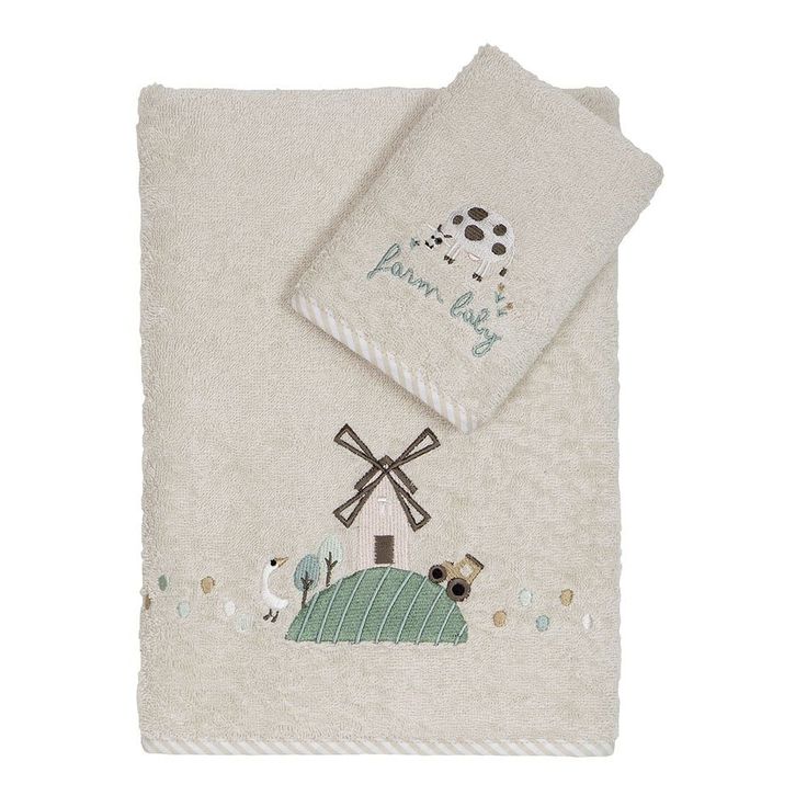 a white towel with a farm scene on it