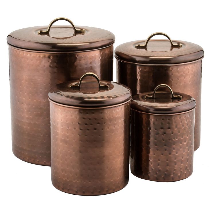 four copper canisters with lids and handles