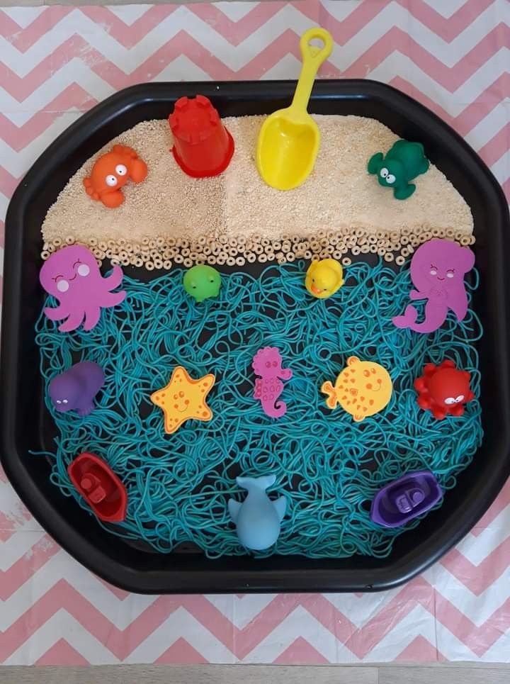 there is a tray that has some toys in it