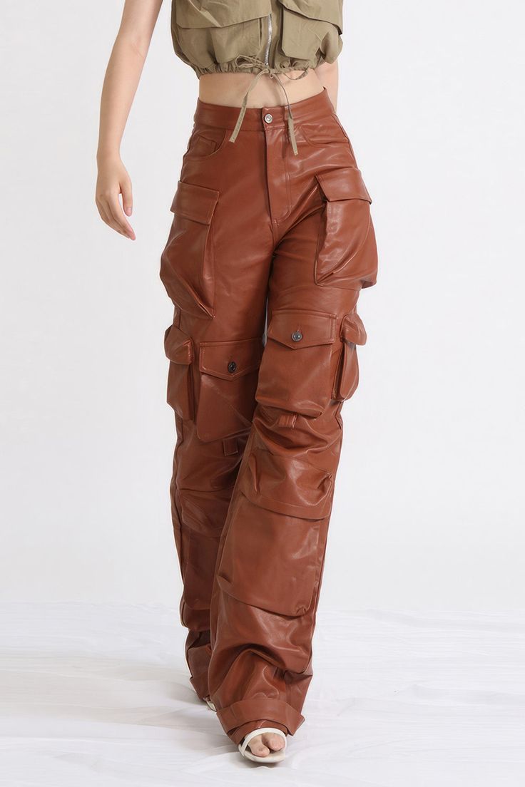 Our Leather Cargo Trousers are crafted with a supple leather-like fabric and feature multiple pockets, a button closure, a straight leg, and classic cargo styling. The perfect blend of form and function, these trousers offer reliable comfort and style. Fabric: Cotton, Polyester Cargo Styling, Cargo Trousers, Fabric Cotton, Brown Leather, Straight Leg, Trousers, Leather, Fabric