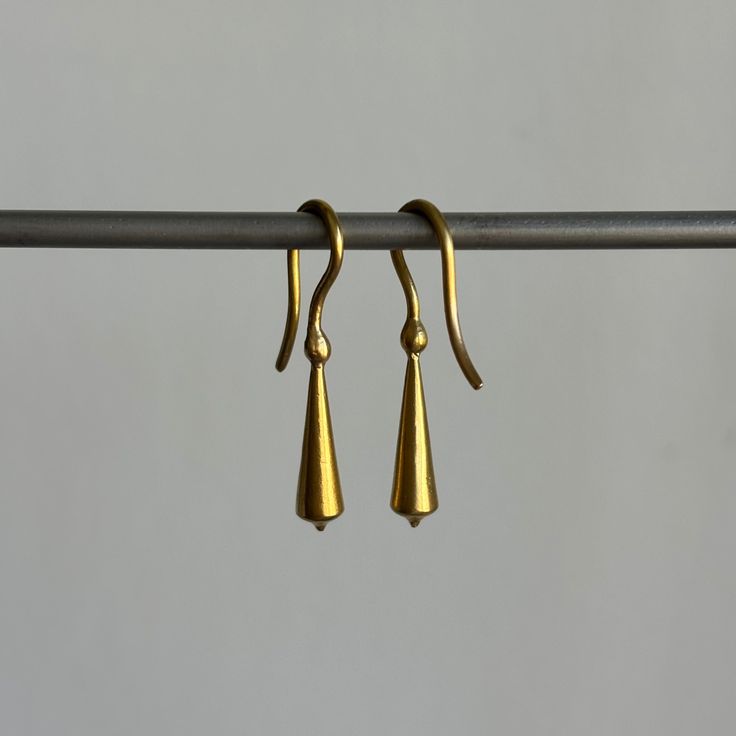 Stately everyday earrings that unite form with fluidity. 22k yellow gold Tapered pod is 5mm x 18mm (3/16" x 3/4")Earrings hang 1 3/16" from the earEach earring weighs 2.4g Classic 22k Gold Earrings, Elegant Recycled Gold Earrings With Ear Wire, Hand Forged Long Drop Modern Earrings, Hand Forged 14k Gold Minimalist Earrings, Modern Formal Earrings In Recycled Gold, Minimalist Teardrop Earrings In Recycled Gold, Modern Recycled Gold Earrings For Formal Occasions, Modern Recycled Gold Earrings For Formal Events, Yellow Gold Teardrop Linear Earrings For Pierced Ears