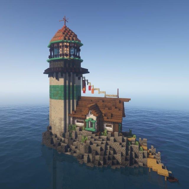 an island with a lighthouse on it in the middle of the ocean