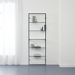 an empty room with white walls and blue flooring in front of the window is a shelf that has various items on it