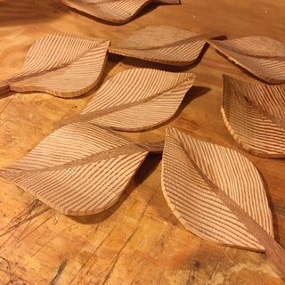 several pieces of wood sitting on top of a wooden table