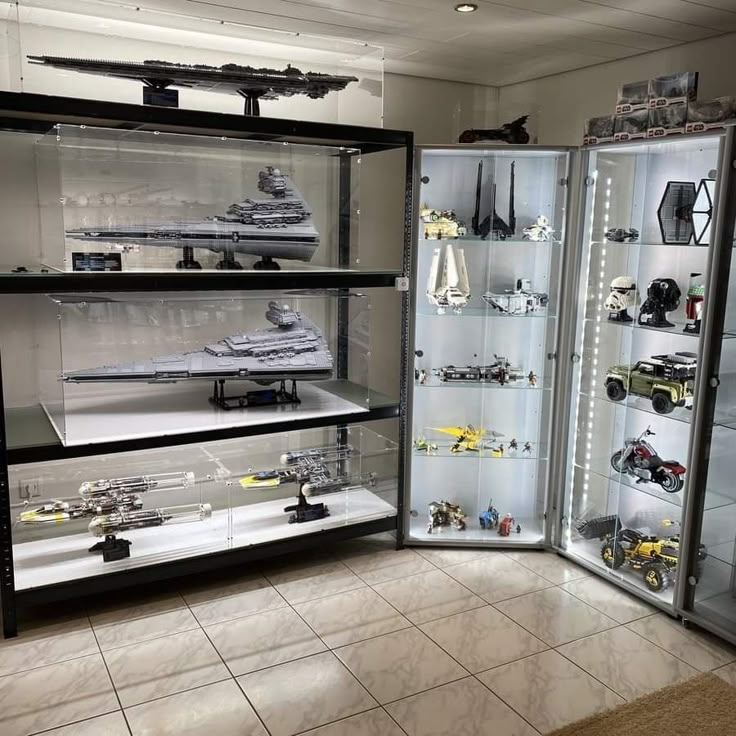 a display case filled with lots of model ships and other toy vehicles on shelves next to each other