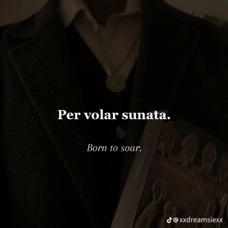 a man in a black coat and white shirt with the words per volar sunata born to soar