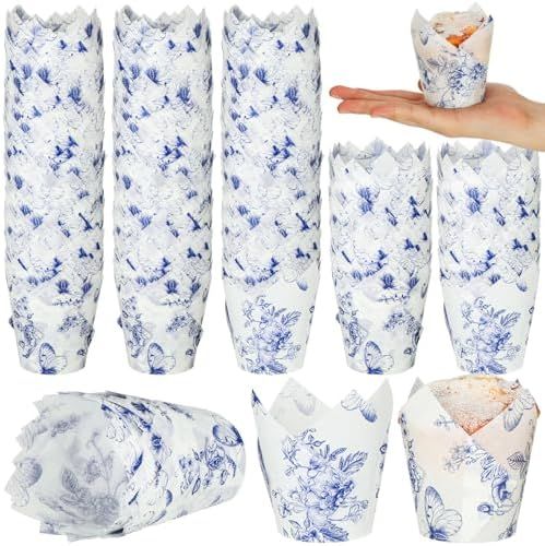 blue and white porcelain vases with hand holding one