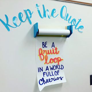 a white refrigerator freezer sitting next to a sign that says keep the quote be a fruit loop in a world full of cheer