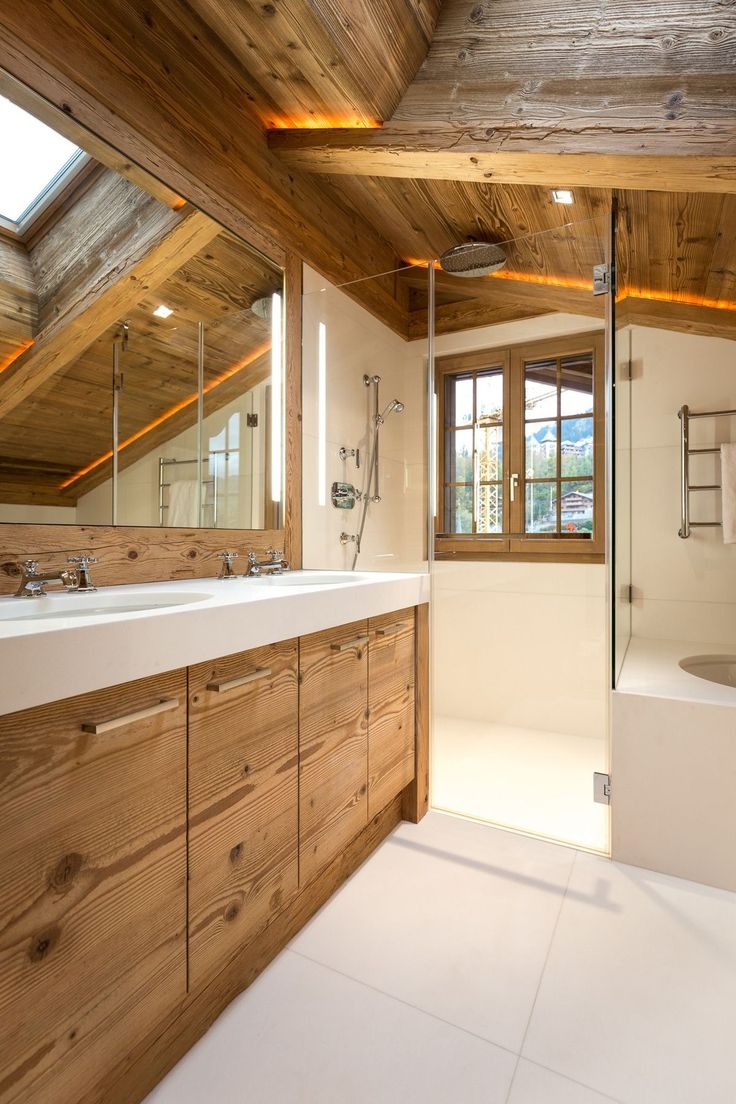 a large bathroom with wooden walls and ceiling