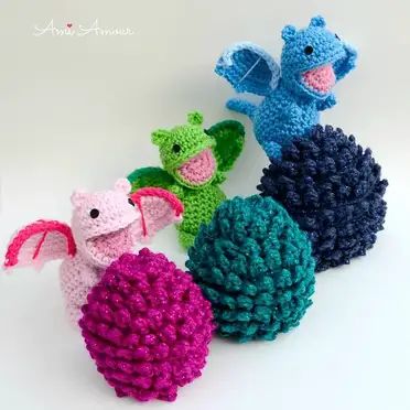 crocheted stuffed animals sitting next to each other