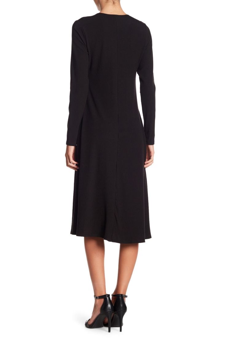 This long sleeve A-line dress is great for the office or dinner and makes for a classy, put-together look.Fit: this style fits true to size. Crew neck. Long sleeves. A-line skirt. Approx. 43" length (size S). Made in USA Stretch Knee-length Long Sleeve Dress For Fall, Fitted Long Sleeve Midi Dress For Work, Elegant Long Sleeve Dress For Fall Workwear, Stretch A-line Midi Dress For Fall, Black Long Sleeve Business Dress, Fitted A-line Long Sleeve Dress For Fall, Solid Color A-line Long Sleeve Dress For Fall, Chic Long Sleeve Business Dresses, Fall Knee-length Long Sleeve Dress