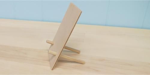 a small wooden stand on top of a table