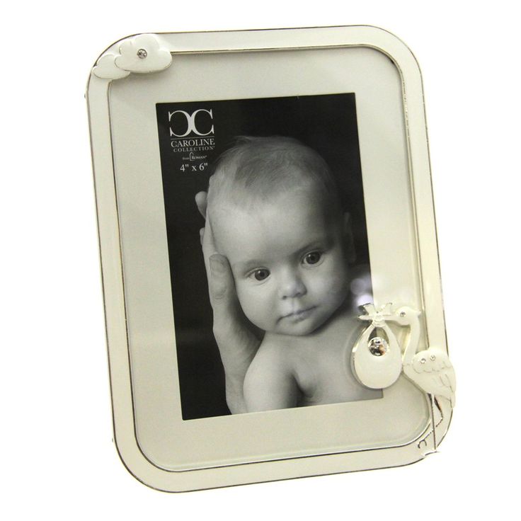 a white photo frame with an angel on the side and a button attached to it