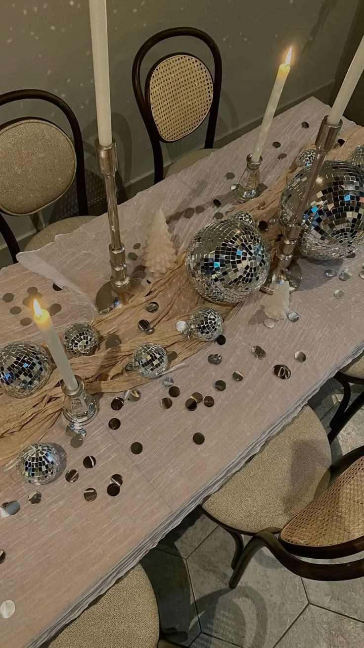 the table is set with candles and decorations