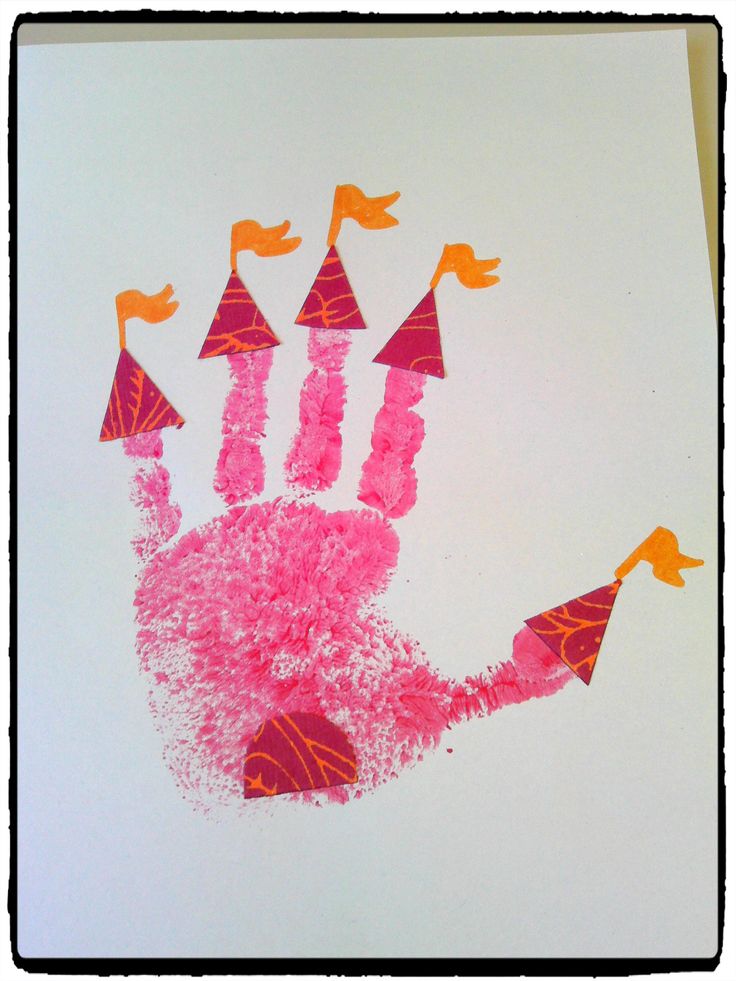 a pink handprint with orange birds on it and some red cones sticking out of the palm