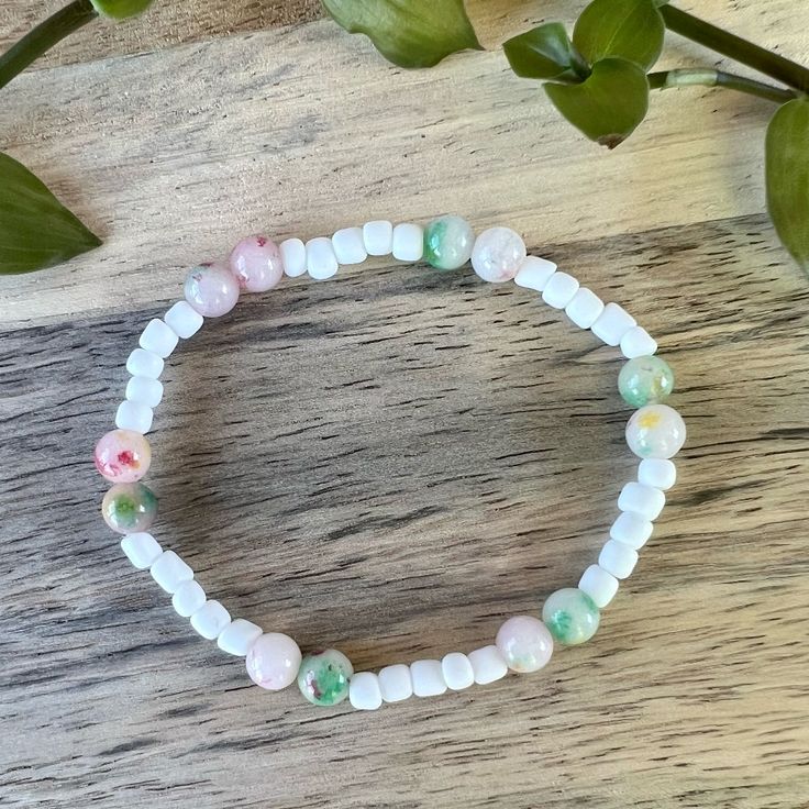 Brighten Up Your Day With Our Handmade White Beaded Bracelet! This Charming Accessory Is Crafted With High-Quality Beads And A Durable Elastic String, Making It Comfortable To Wear And Perfect For Any Occasion. Featuring A Lovely Mix Of Soft Pastel Shades, This Bracelet Is The Perfect Way To Add Personality To Your Outfit. Wear It To The Office, Out With Friends, Or Even Just Around The House - This Bracelet Is Versatile And Fun! Our Handmade Bracelet Is A Thoughtful And Genuine Gift For Anyone Casual Beaded Bracelets With Round Beads For Spring, White Bohemian Beaded Necklaces For Spring, Bohemian Stretch Bracelet With Round Beads For Spring, Bohemian Stretch Bracelet With Colorful Beads For Spring, White Round Beaded Friendship Bracelets For Spring, Casual Stretch Bracelet With Round Beads For Spring, White Stretch Bracelet For Beach In Spring, Casual Tiny Beads Bracelets For Spring, White Stretch Bracelet For Beach Spring Season