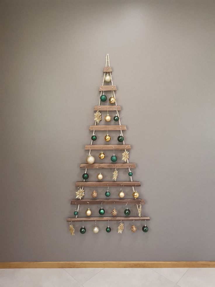 a wooden christmas tree with ornaments hanging from it