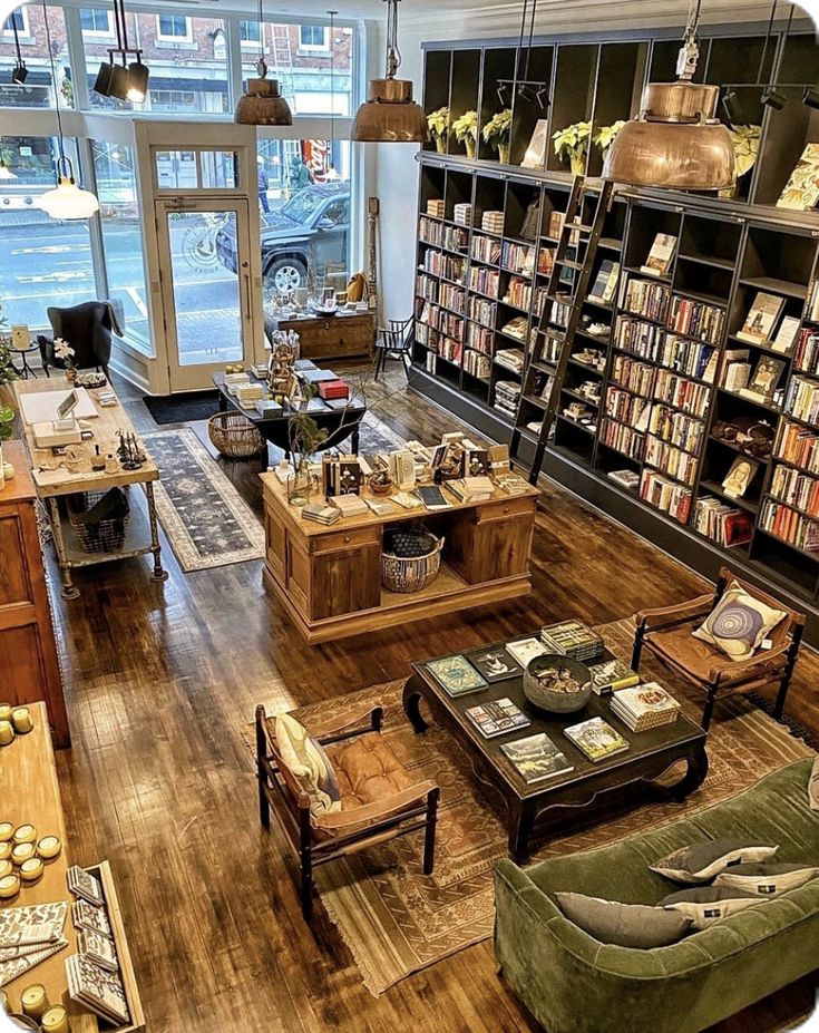 a room filled with furniture and lots of books