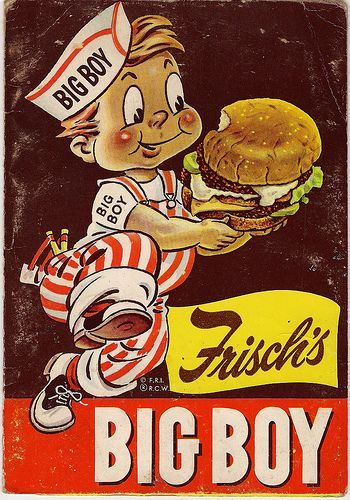 an old advertisement for a big boy burger with a child holding a large hamburger in his hand