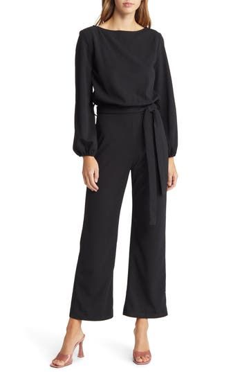 The jumpsuit trend is, well, hopping, and this option, styled with an easy tied waist and elastic cuffs, is a winning way to wear the look. Bateau neck Long sleeves with elastic cuffs Removable tie belt Unlined 60% polyester, 40% cotton Dry clean Made in the USA Cocktail Attire For Women, Black Pantsuit, Coverall Jumpsuit, Formal Jumpsuit, Tie Waist Jumpsuit, Maxi Jumpsuit, Ruffle Jumpsuit, Petite Jumpsuit, Jumpsuit Dressy