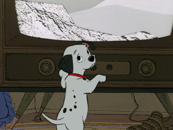 a cartoon dog standing in front of a tv with snow on the mountain behind it