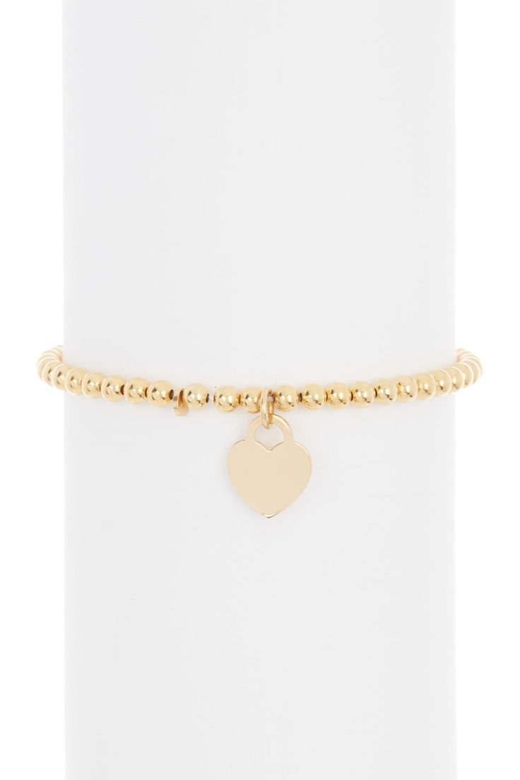 14K gold plated sterling silver ball bead heart charm bracelet. Stretch construction. Approx. 6.5" length. Approx. 4mm beads. Imported Adjustable Gold Stretch Bracelet With Heart Charm, Elegant Gold Stretch Bracelet With Heart Beads, Elegant Beaded Bracelet With Heart Charm For Valentine's Day, Elegant Beaded Bracelets With Charms For Valentine's Day, Elegant Round Beads Stretch Bracelet For Valentine's Day, Gold Stretch Bracelet With Heart Charm, Elegant Gold Charm Bracelet With Heart Beads, Elegant Stretch Bracelet With Heart Charm, Elegant Stretch Bracelet With Heart Beads