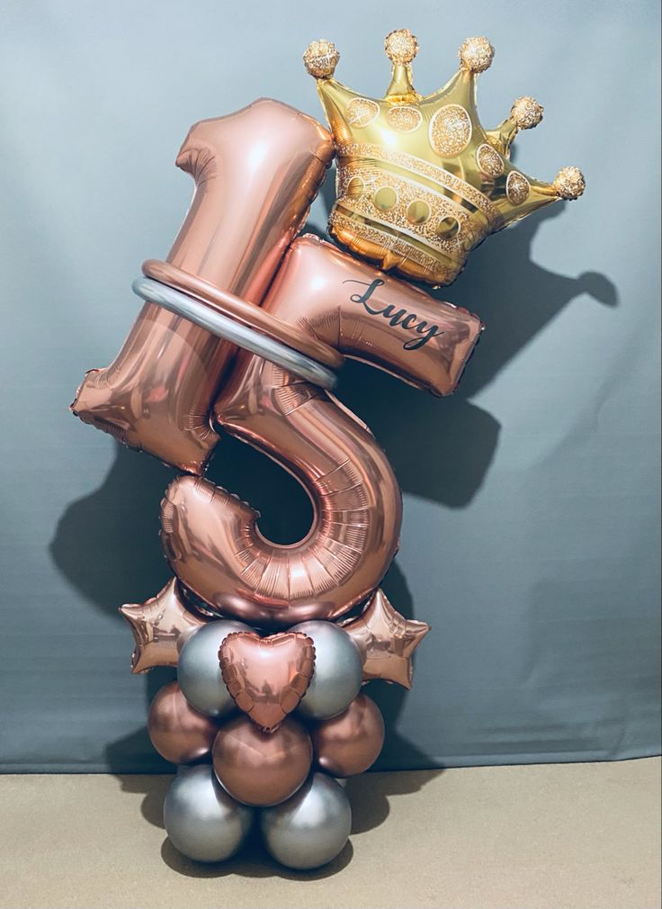 a number three balloon with a crown on top