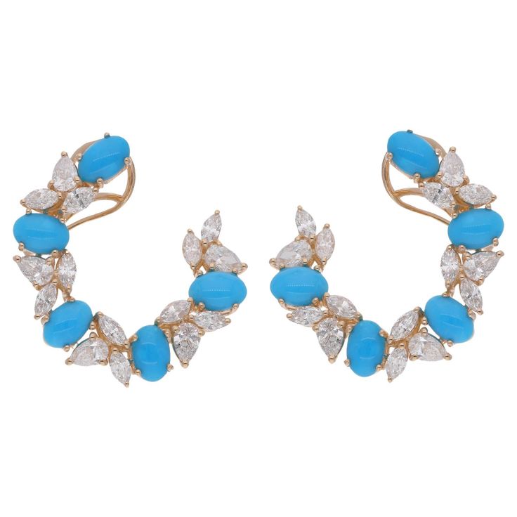 Immerse yourself in the enchanting beauty of our Oval Turquoise Gemstone Hoop Earrings, adorned with Diamonds and crafted with exquisite artistry in 18 Karat Yellow Gold. These earrings are more than just accessories; they are a testament to refined taste and timeless elegance. Item Code :- SEE-15581 Gross Wt. :- 9.51 gm 18k Yellow Gold Wt. :- 8.26 gm Natural Diamond Wt. :- 2.68 Ct. ( AVERAGE DIAMOND CLARITY SI1-SI2 & COLOR H-I ) Turquoise Wt. :- 3.56 Ct. Earrings Size :- 23 mm approx. ✦ Sizing Hoop Earrings Diamond, Gemstone Hoop Earrings, Turquoise Stud Earrings, Earrings Diamond, Diamond Hoop Earrings, Jewelry Earrings Hoops, Turquoise Earrings, Turquoise Gemstone, Diamond Clarity