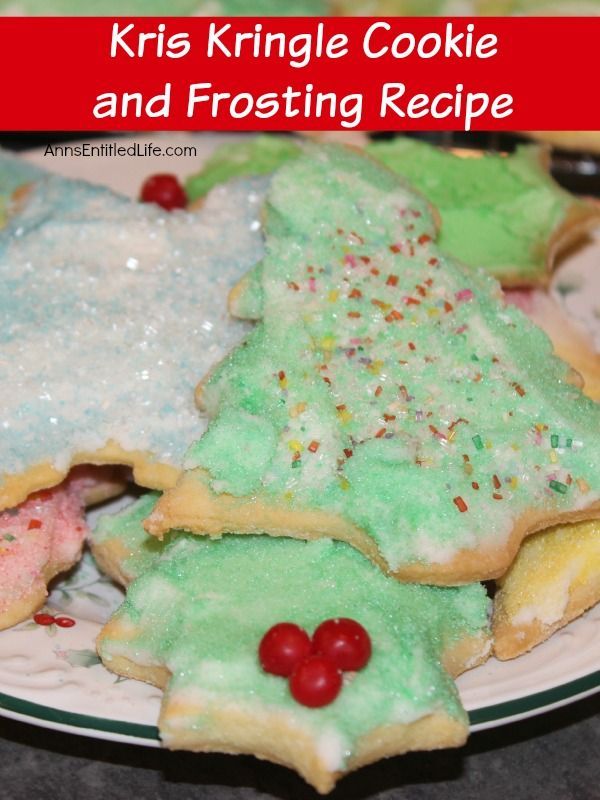 a plate with christmas cookies and frosting on it