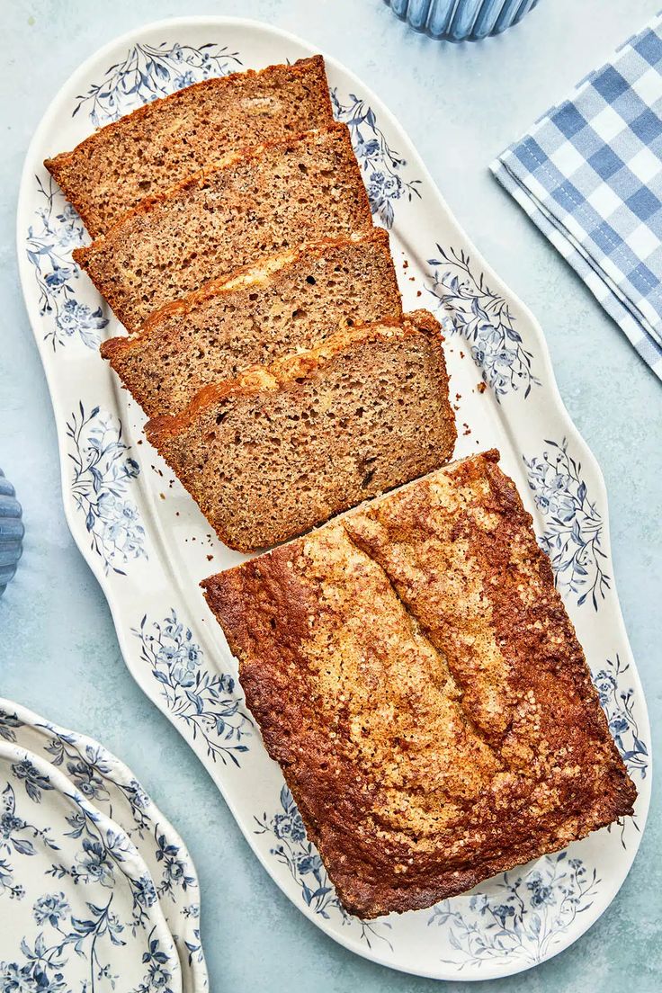 three slices of banana bread on a blue and white plate