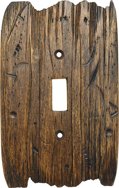 an old wooden switch plate cover with holes in the middle and one hole at the bottom