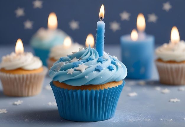 cupcakes with blue frosting and lit candles