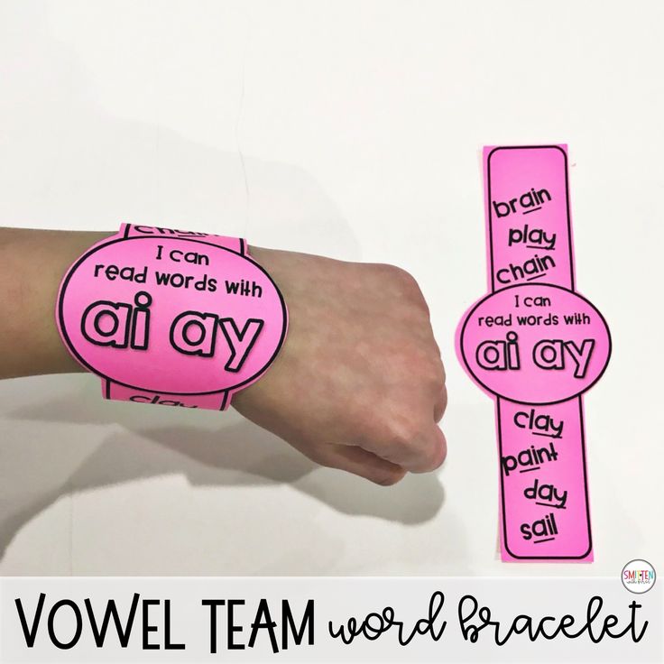 a pink wristband with words on it and an image of a woman's arm