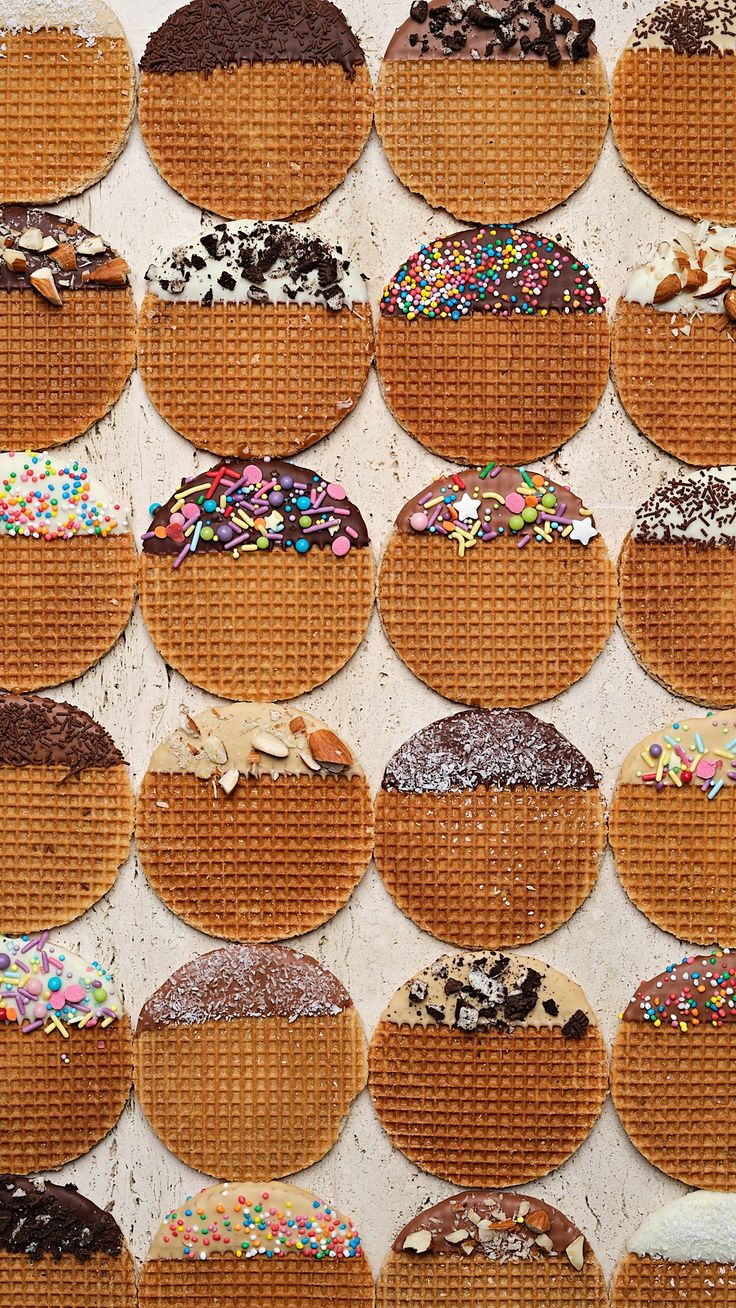 many different types of donuts on display in baskets