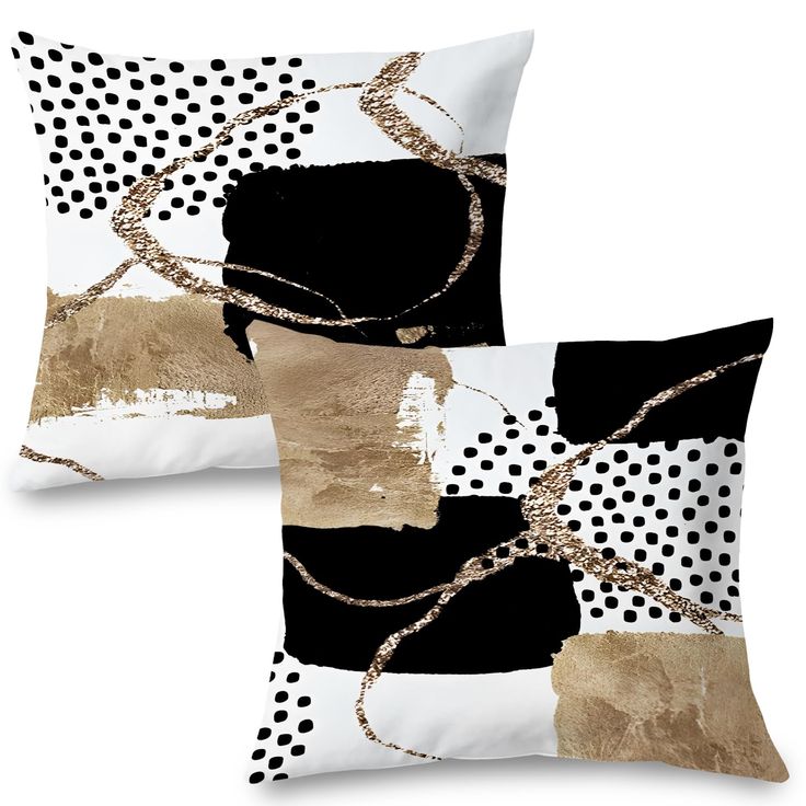 two black and white pillows with gold foil paint on the front, one is square