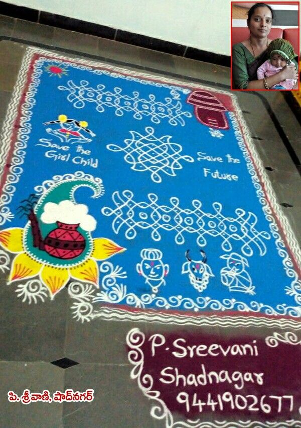 a woman holding a baby standing in front of a blue and white carpet with writing on it