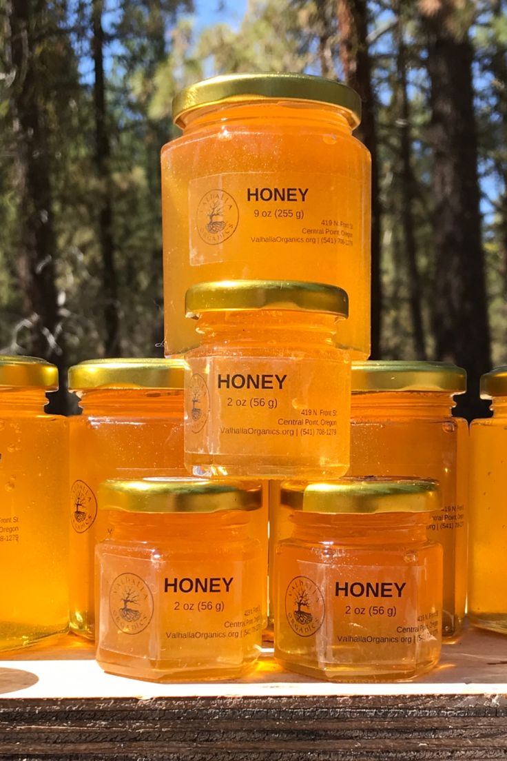 honey jars are stacked on top of each other