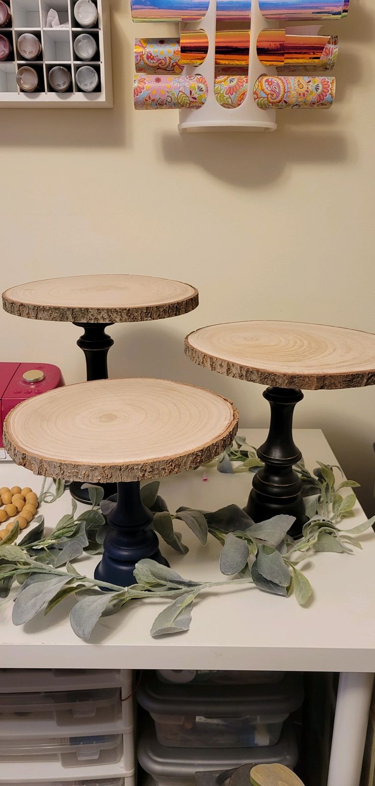 three wooden plates sitting on top of a table