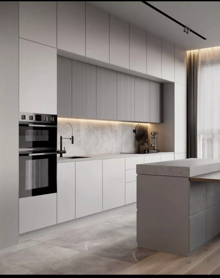 a modern kitchen with white cabinets and counter tops