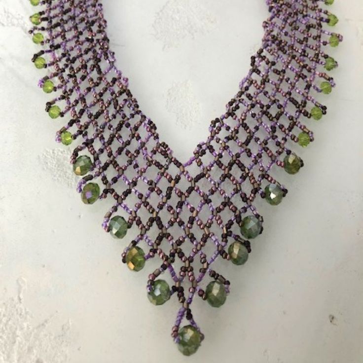 Artisan Czech Glass Bead 20" Long Fashion Statement "V" Style Necklace Purple, Green Glass Beads Necklace With Shimmering & Iridescent Beads Easy To Open/Close Magnetic Clasp One Of A Kind Necklace Handcrafted/No Two Are Exactly Alike Would Be Perfect For A Get-A-Way Destination Dress! Necklace Is Made In Guatemala Using Artisan Crafted Czech Glass Beads. Czech Glass Beads Are Know World Wide For Their Quality, Vibrant Colors Principles Of Fair Trade Upheld Handmade Unique Amethyst Beaded Necklaces, Unique Handmade Amethyst Beaded Necklaces, Handmade Purple Beaded Necklaces With Round Beads, Purple Large Beads Jewelry For Festival, Purple Beaded Necklaces With Large Round Beads, Purple Beaded Necklaces With Round Beads, Purple Beaded Necklaces For Festival, Purple Beaded Necklace For Festivals, Purple Beaded Necklace For Festival