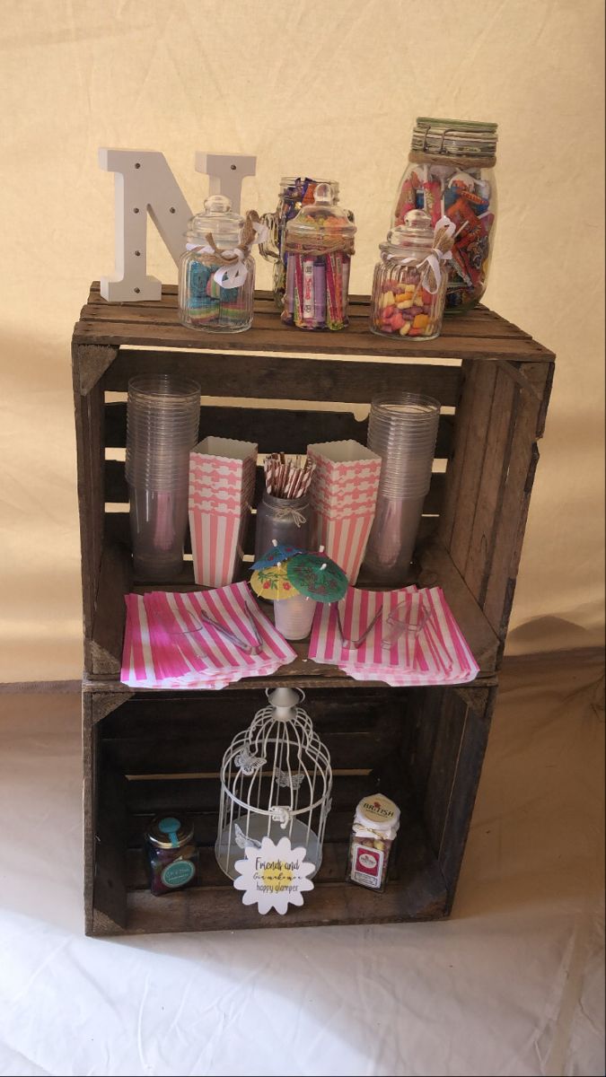 a wooden shelf with cups and other items on it