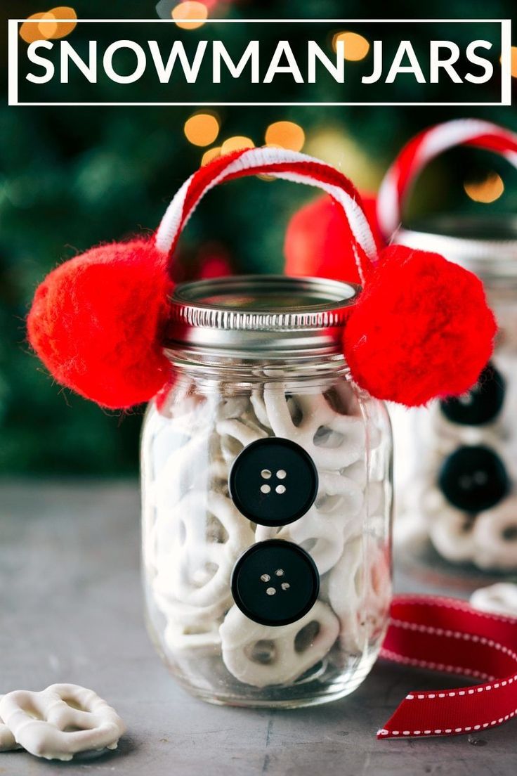 a mason jar filled with buttons and red pom - poms for snowman jars