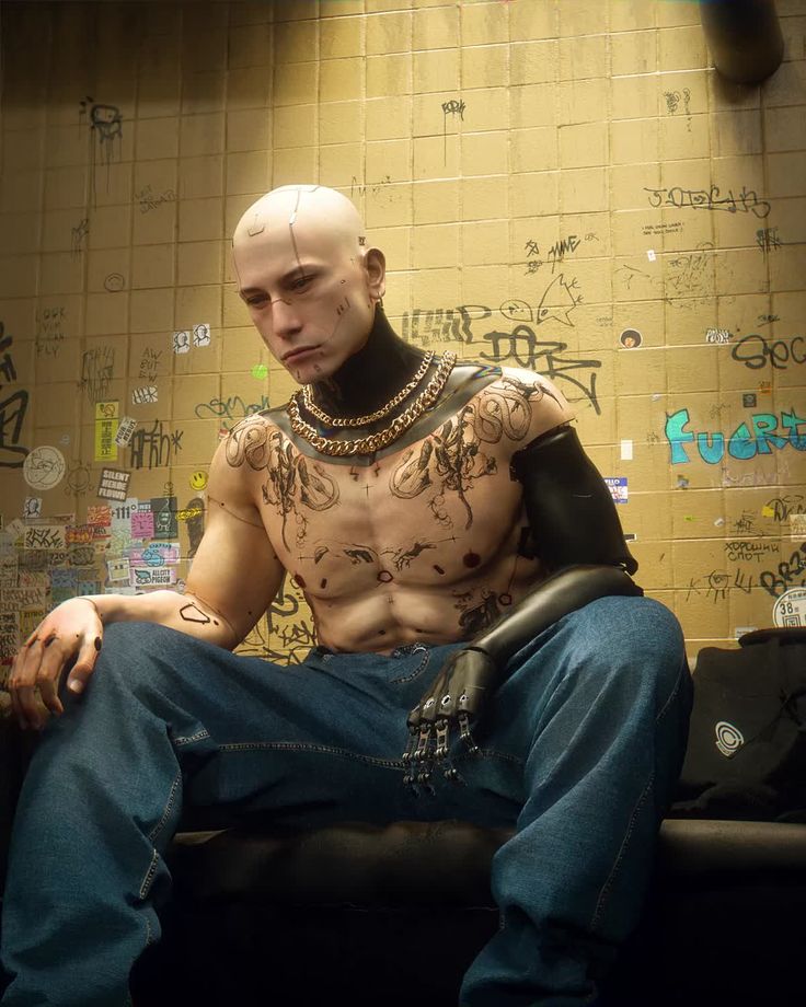 a man sitting on top of a black chair next to a wall covered in graffiti