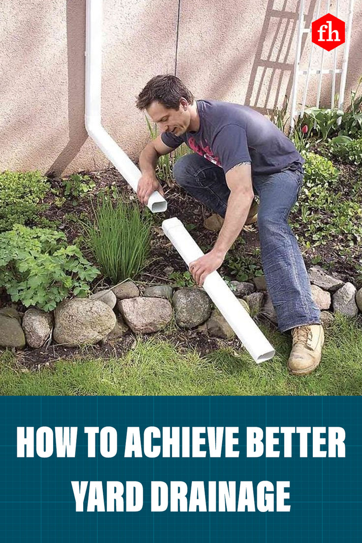 a man is working on a yard drainage system