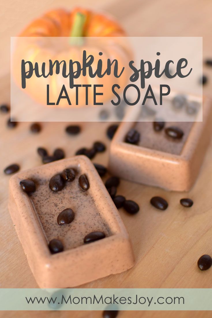 pumpkin spice latte soap on a wooden table with coffee beans and an orange in the background