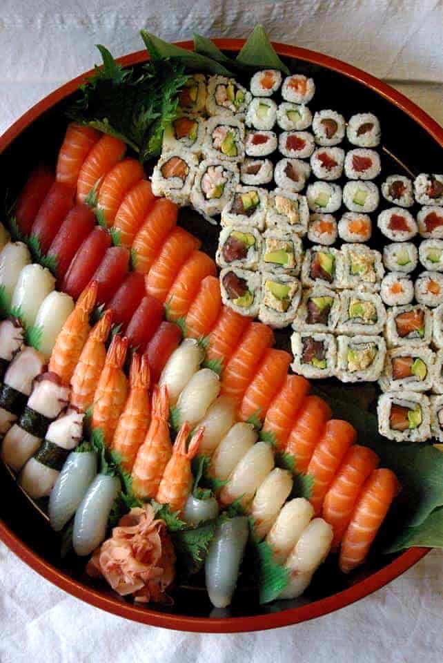 an assortment of sushi on a platter